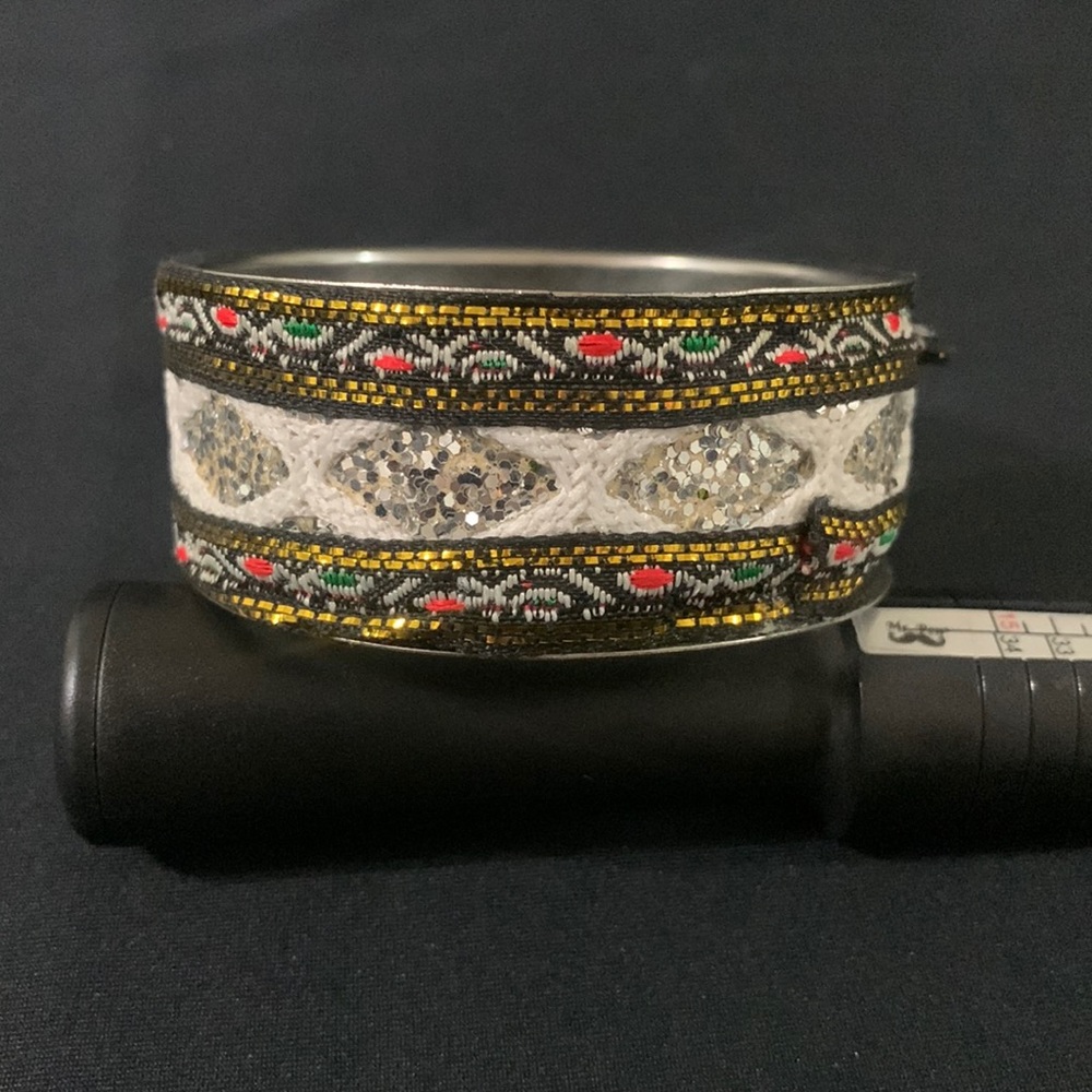 Metal and fabric handmade bracelet with colorful tribal design